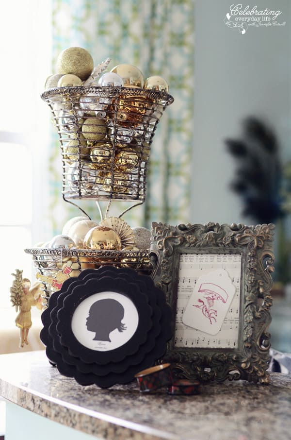 Framed Silhouette, Framed sheet music, and Ornament ball display